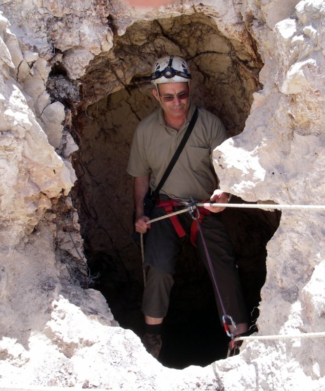 Prof. Amos Frumkin from Hebrew University’s Cave Research Center descends into the Manot Cave in Israel’s Galilee, where a 55,000-year- old skull sheds new light on human migration patterns. (Photo: Hebrew University Cave Research Center)