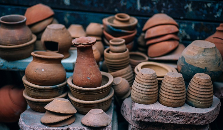 Canva - A Collection of Pots