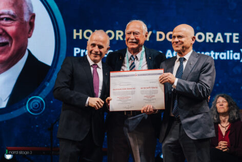 Professor Leon Mann AO receiving his Honorray Doctorate Citation from left HU President Professor Asher Cohen and right HU Rector Professor Tamir Sheafer